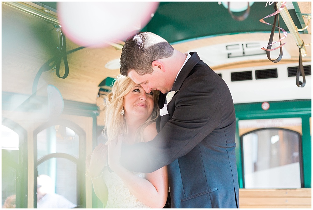 Bride and Groom on trolley | Downtown Indianapolis Wedding by Gabrielle Cheikh Photography & Jessica Dum Wedding Coordination