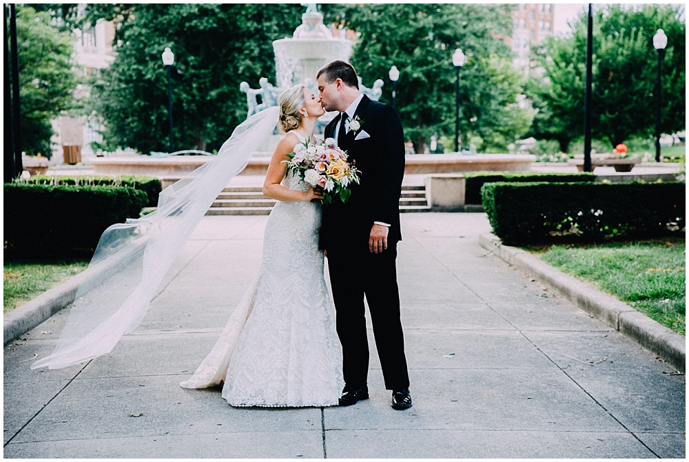 Bride and Groom with organic wedding blooms | Downtown Indianapolis Wedding by Caroline Grace Photography & Jessica Dum Wedding Coordination