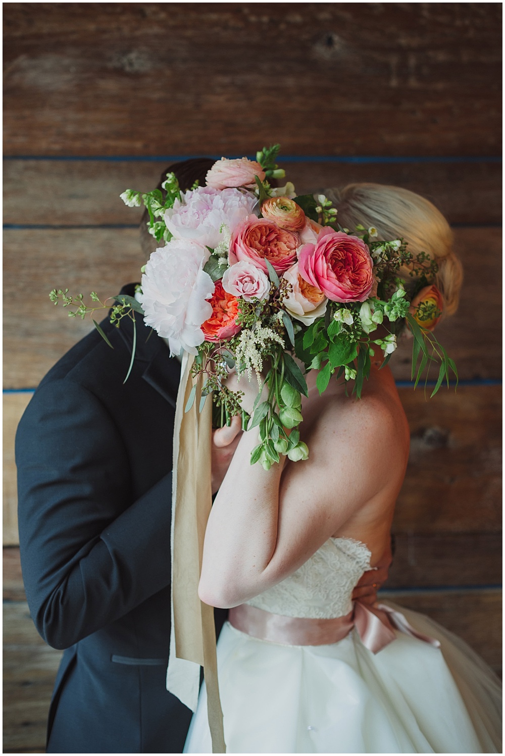 Bride and Groom with blush, pink and green bridal bouquet and silk ribbon | Ritz Charles Garden Pavilion Wedding by Stacy Able Photography & Jessica Dum Wedding Coordination