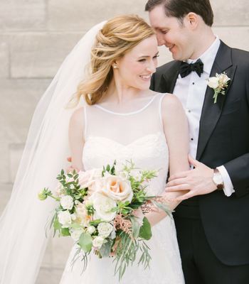 bride and groom portraits; white wedding dress; blush and white bridal bouquet with greenery; Navy + blush wedding; Scottish Rite Cathedral Indianapolis | Traci & Troy Photography and Jessica Dum Wedding Coordination